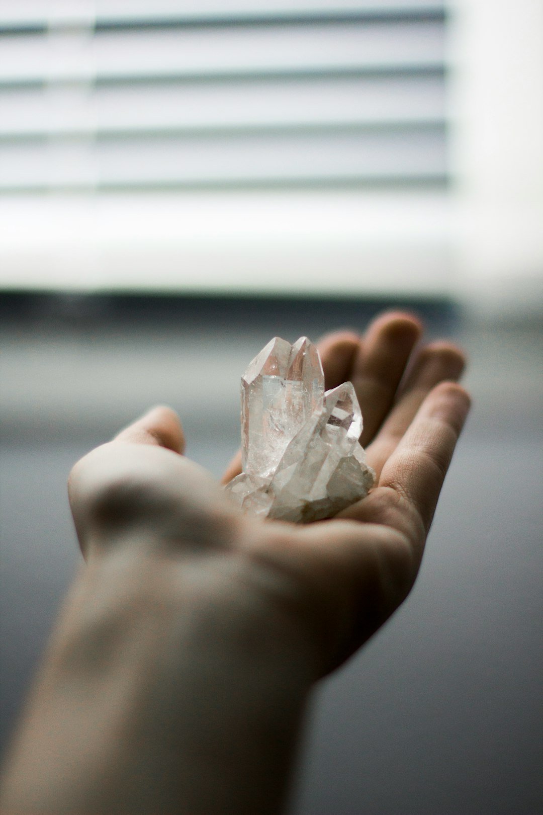 person-holding-crystal-stones-hu1pjvyvdxi
